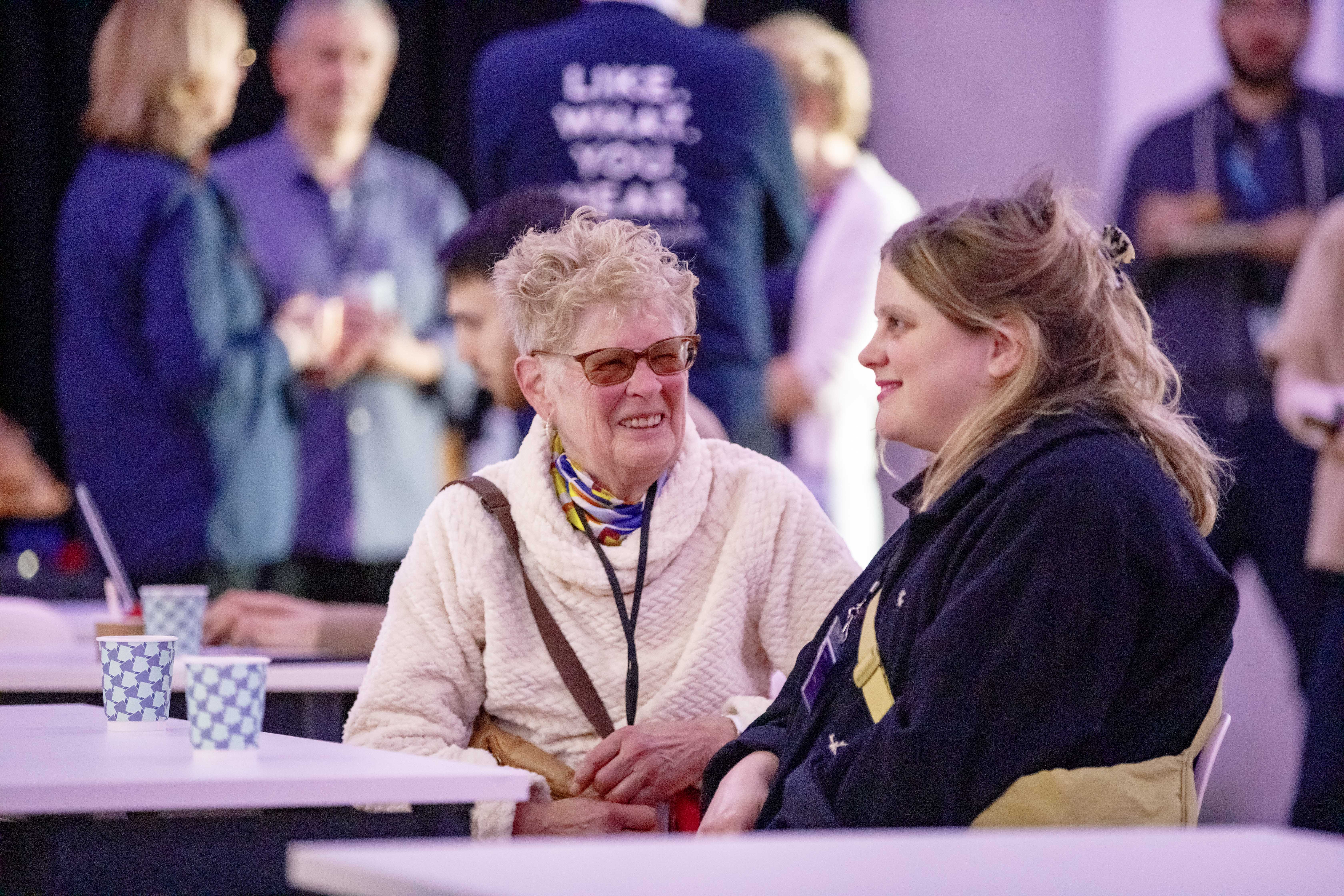 A person looking thoughtfully at a sound wave visualization, representing Sownd Affects' values.
